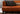 Right Side View Cinnamon 4-Seater Leather Sofa, have a stylish frame and are comfortable for modern living spaces.